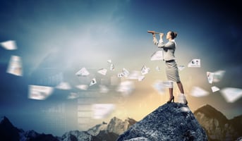 Image of businessperson looking in telescope standing on a rock