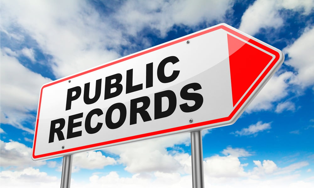 Public Records - Inscription on Red Road Sign on Sky Background